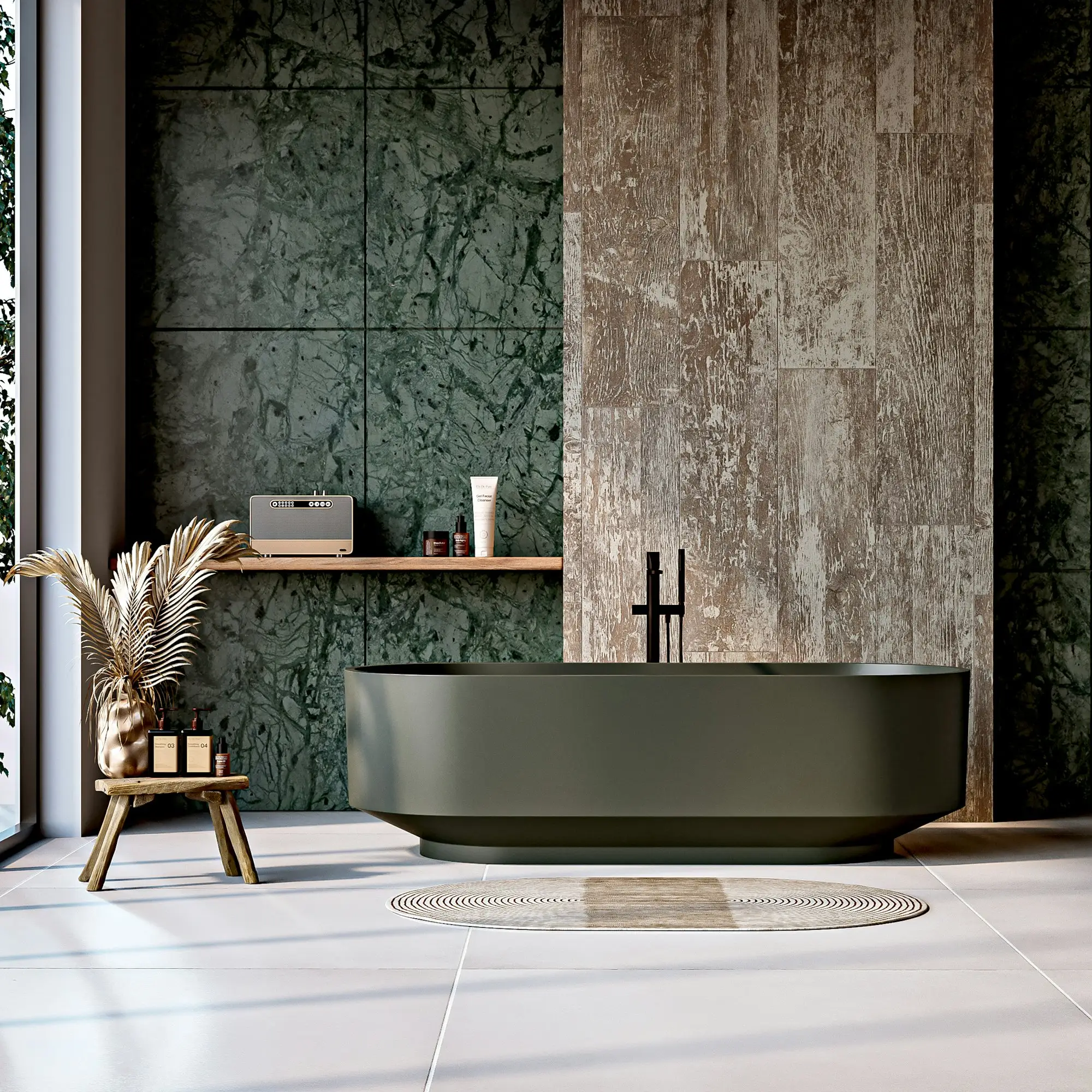 Guest bath lined in green stone with a soaking tub