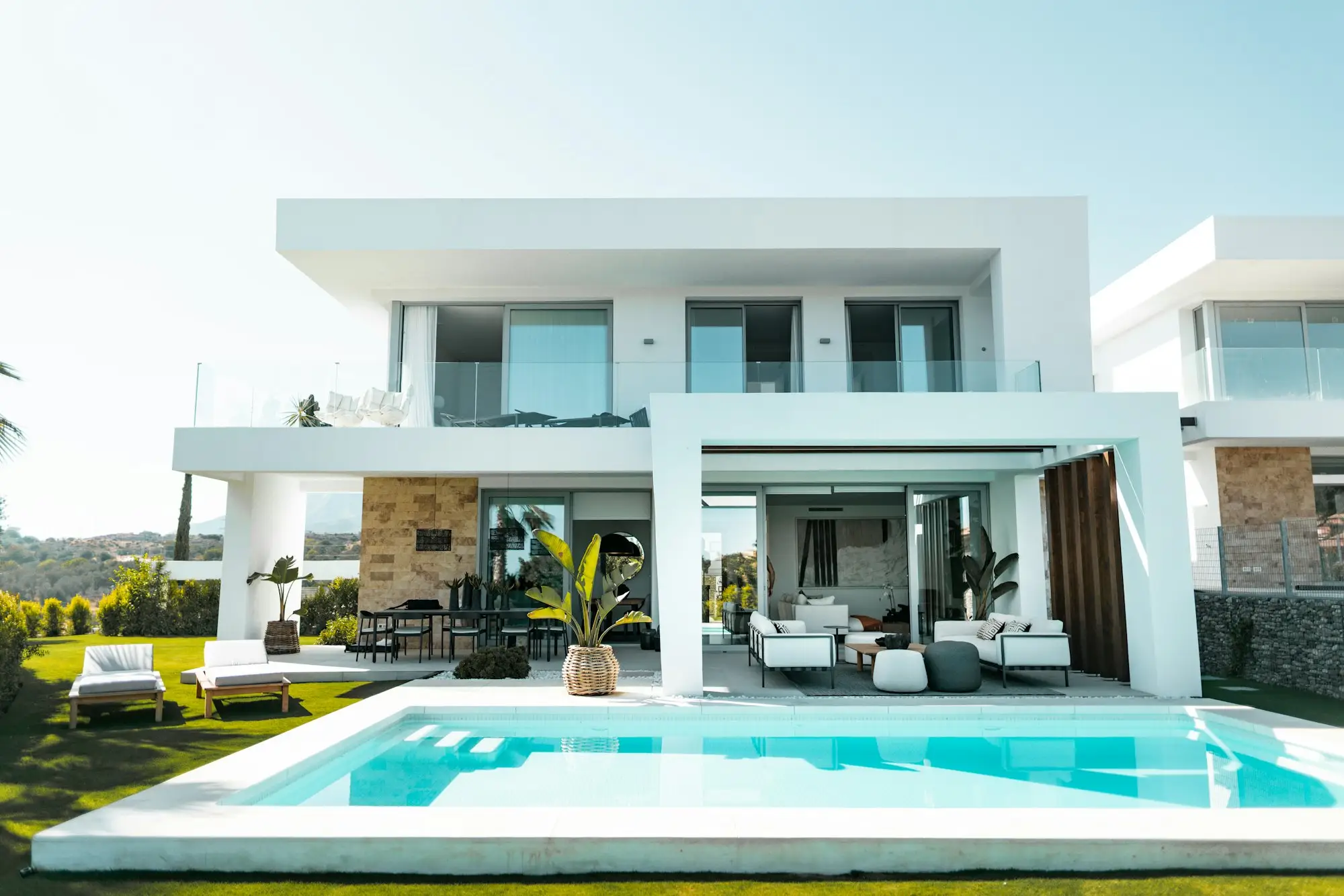 Modern house with a pool terrace and lounge chairs
